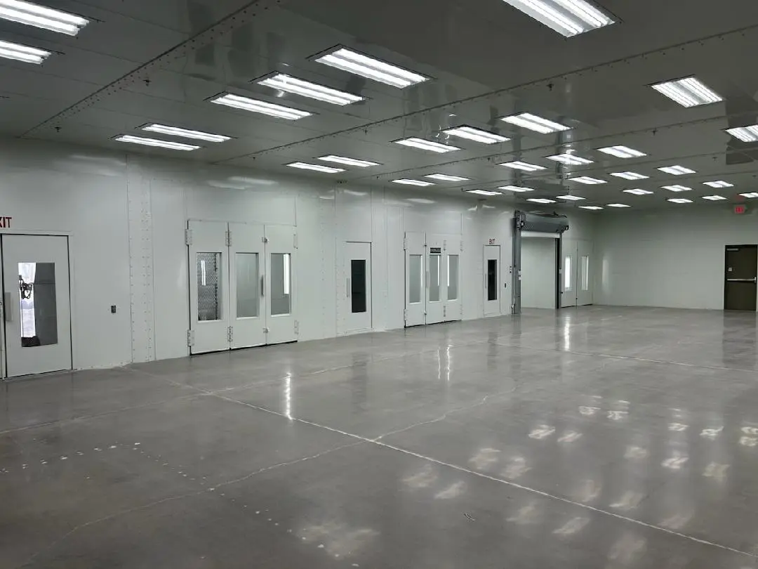 A large room with many doors and windows.